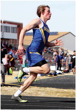 SCOBEY SOPHOMORE ZAK TRAEHOLT negotiates the first curve