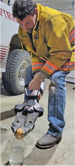 SCOBEY FIREMAN ROB MAHER, squeezes ….