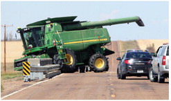 A JOHN DEERE COMBINE