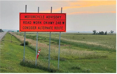 THE ROAD CONSTRUCTION sign along ….