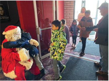 SANTA got a big hug ….