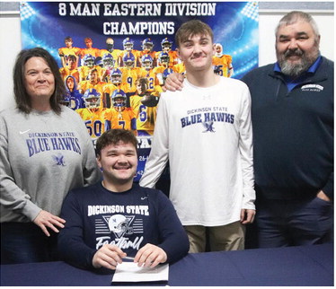 COOPER AXTMAN (seated) signed a ….